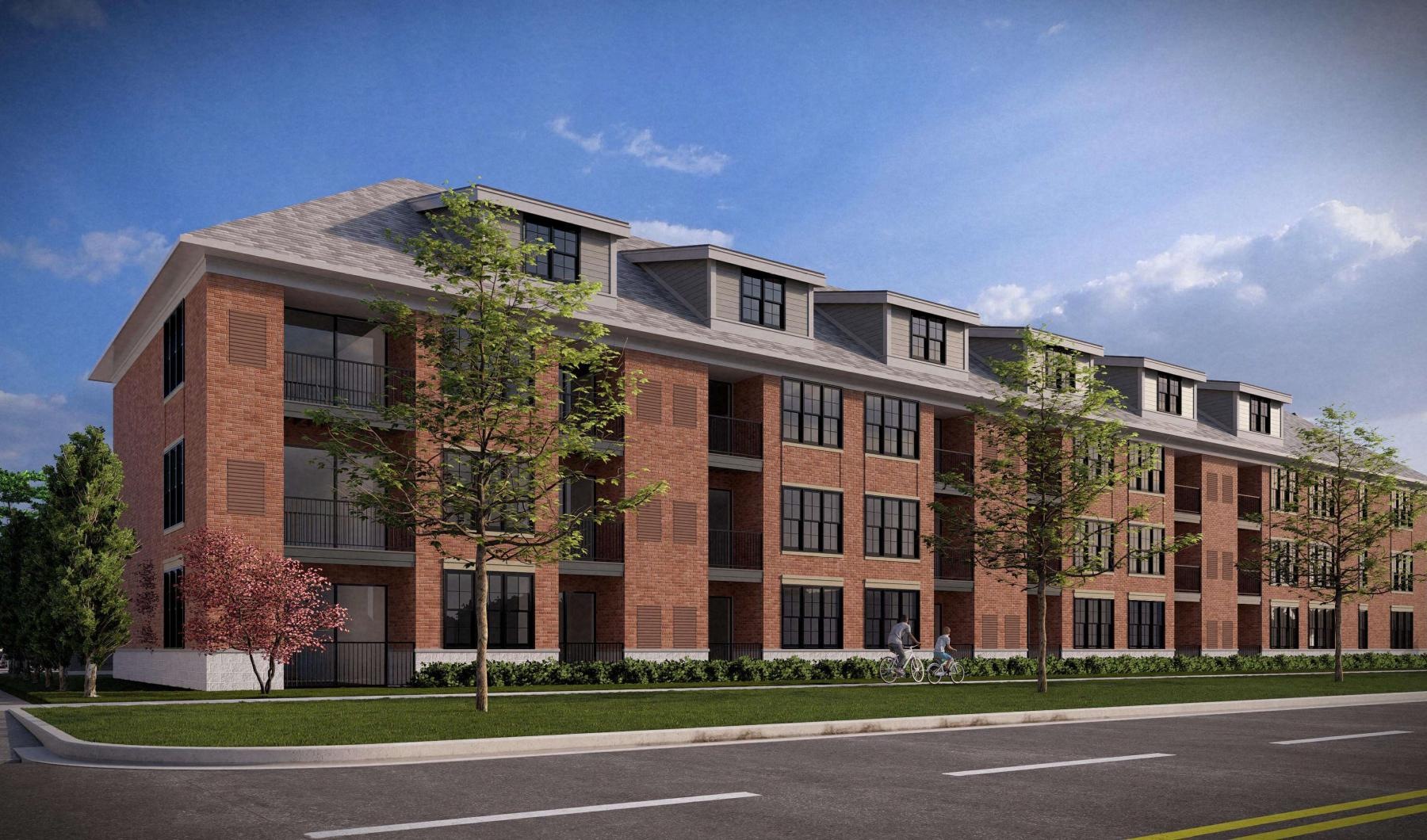 a large brick building with trees in front of it