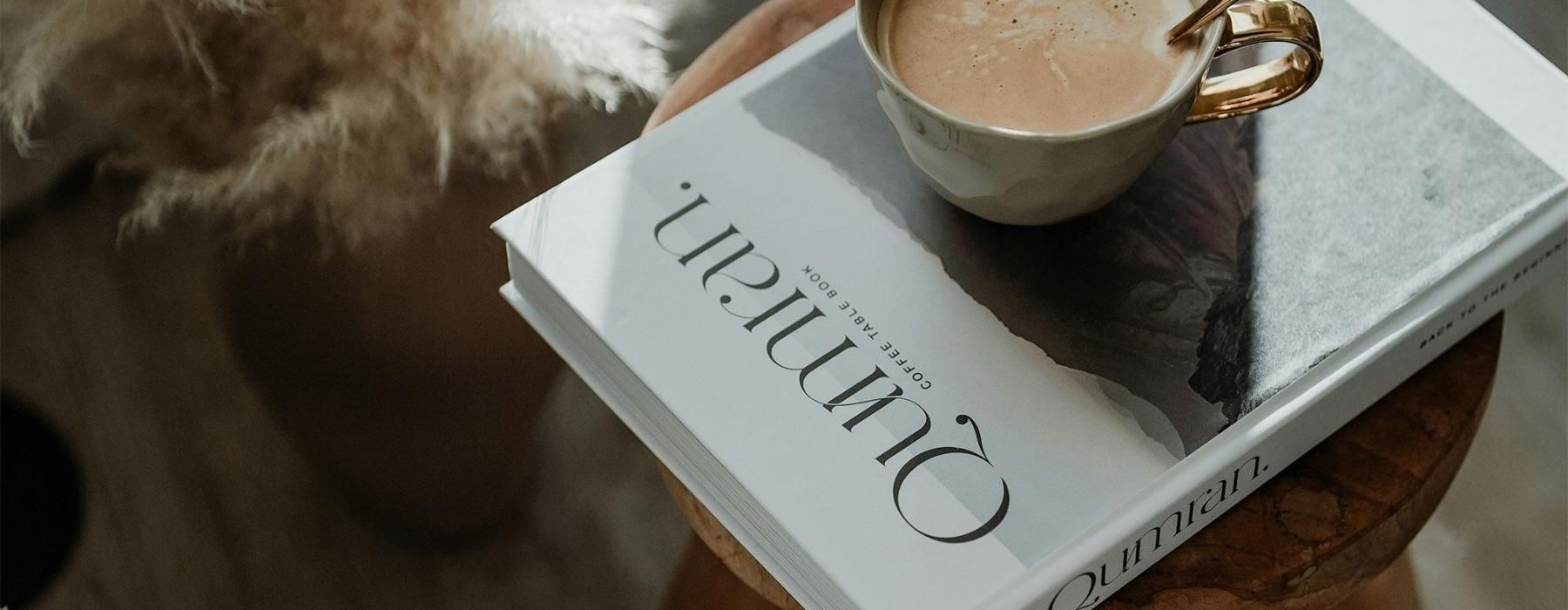 a cup of coffee on a book
